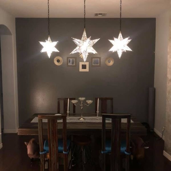 Star lights installed over table.