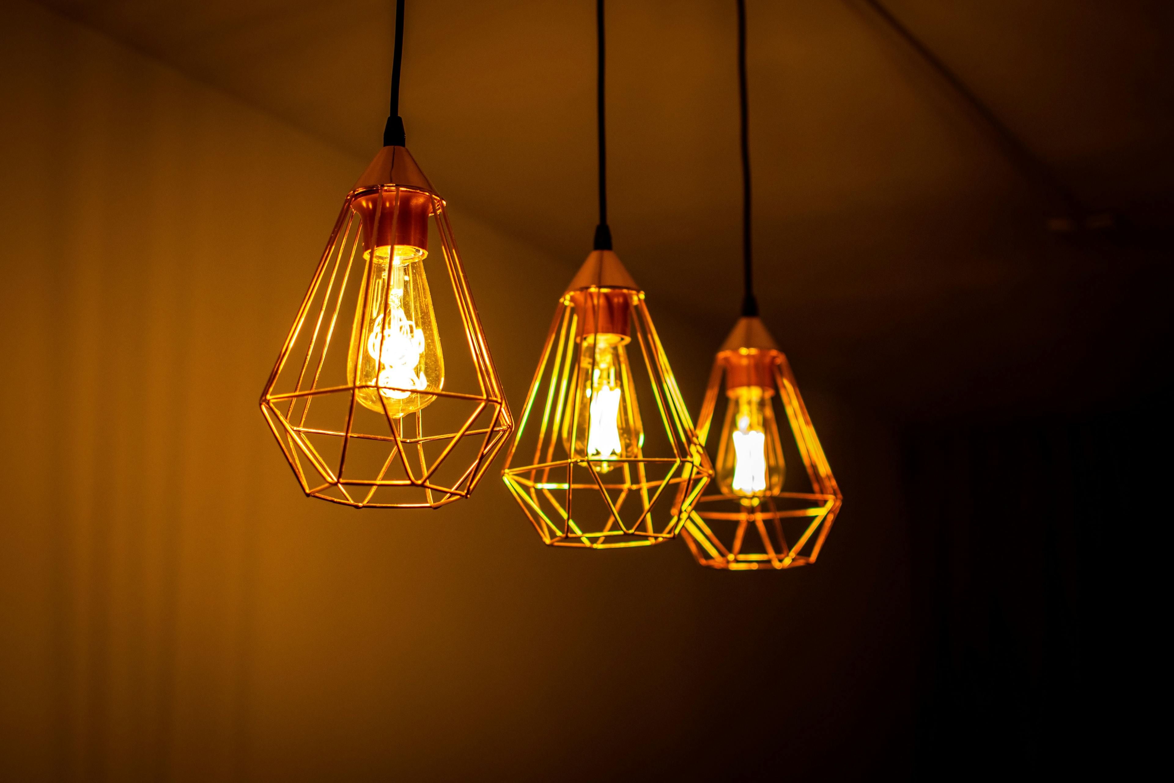 Three modern retro light bulbs hanging