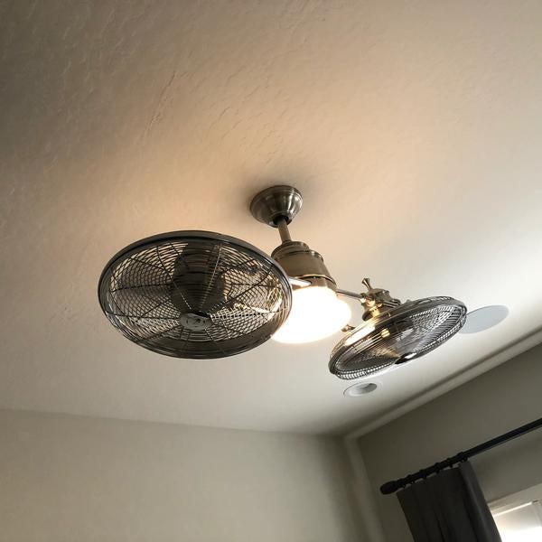 Twin turbo ceiling fan with dual fans and a light.