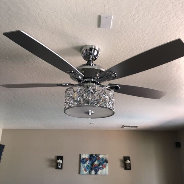 Chrome ceiling fan installed in living room.