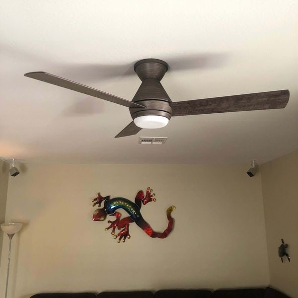 Pewter three blade ceiling fan installed in living room.